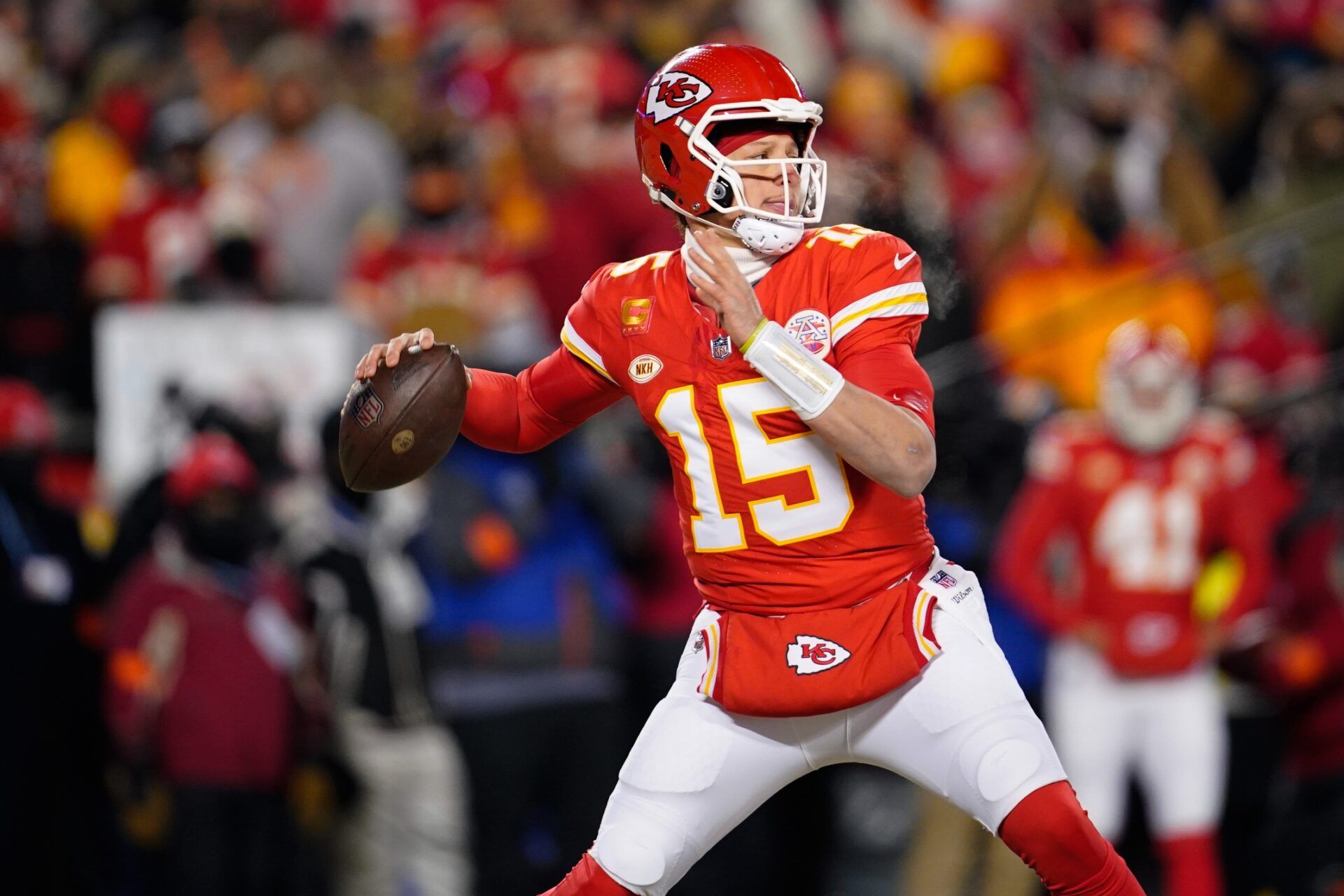 Kansas City Chiefs quarterback Patrick Mahomes (15) throws against the Miami Dolphins during the first half of the 2024 AFC wild card game at GEHA Field at Arrowhead Stadium.