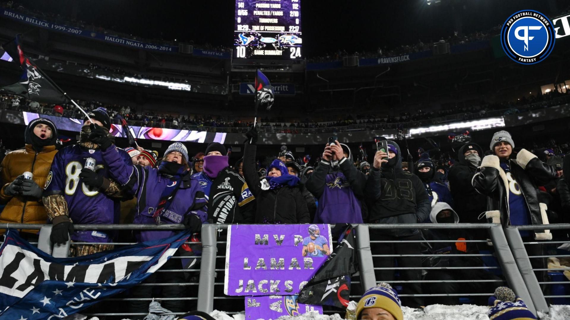 Baltimore Ravens fans celebrate after a score against the Houston Texans during the fourth quarter of a 2024 AFC divisional round game at M&T Bank Stadium.