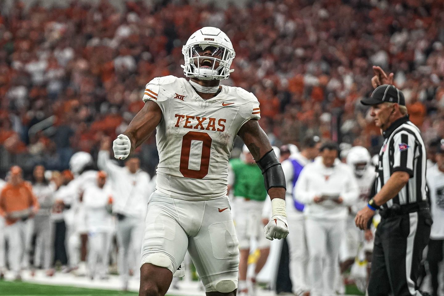 Ja'Tavion Sanders (0) celebrates a catch for a first down against the Oklahoma State Cowboys.