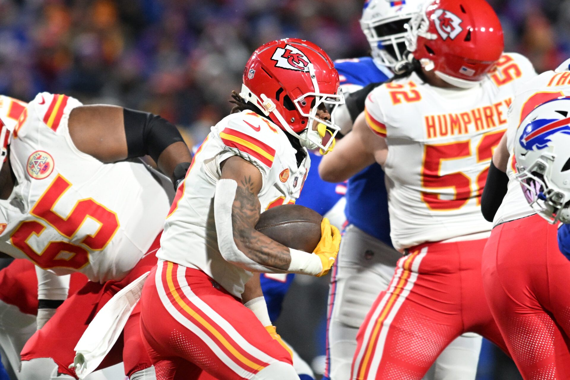 Kansas City Chiefs running back Isiah Pacheco (10) rushes the ball against the Buffalo Bills in the first half of the 2024 AFC divisional round game at Highmark Stadium.