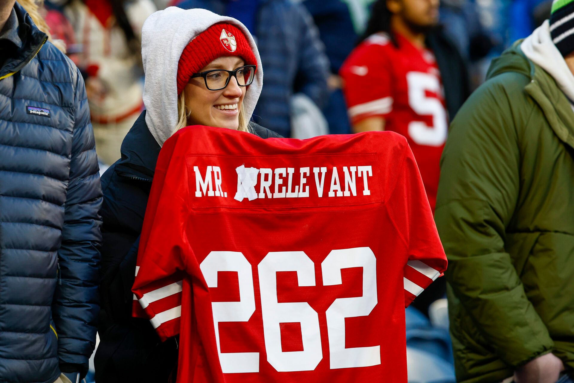 A fan holds an altered “Mr. Irrelevant” jersey for San Francisco 49ers quarterback Brock Purdy (not pictured) during pregame warmups against the Seattle Seahawks at Lumen Field.