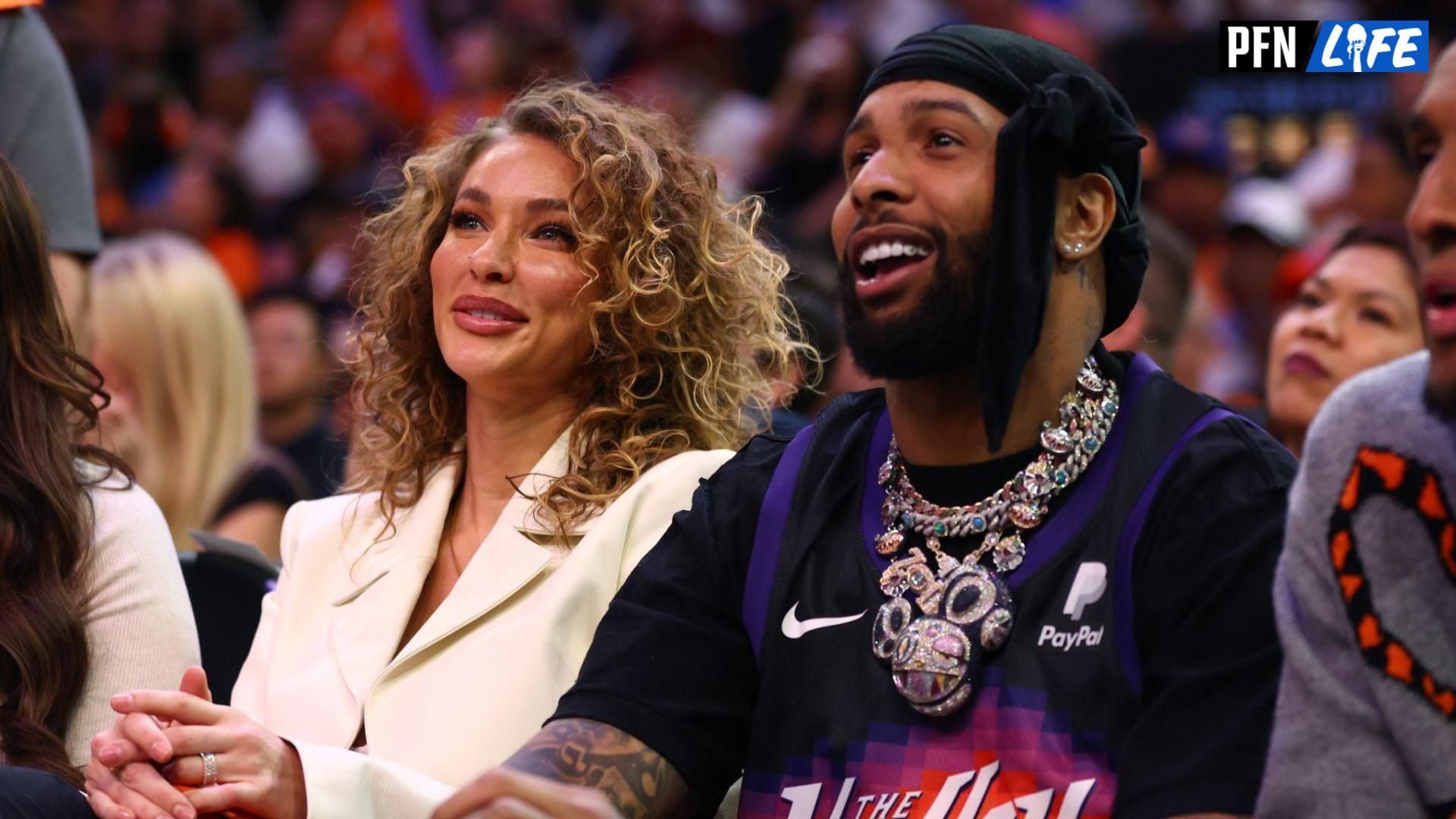 Baltimore Ravens WR Odell Beckham Jr. and his girlfriend, Lauren Wood, sitting courtside at an NBA game.