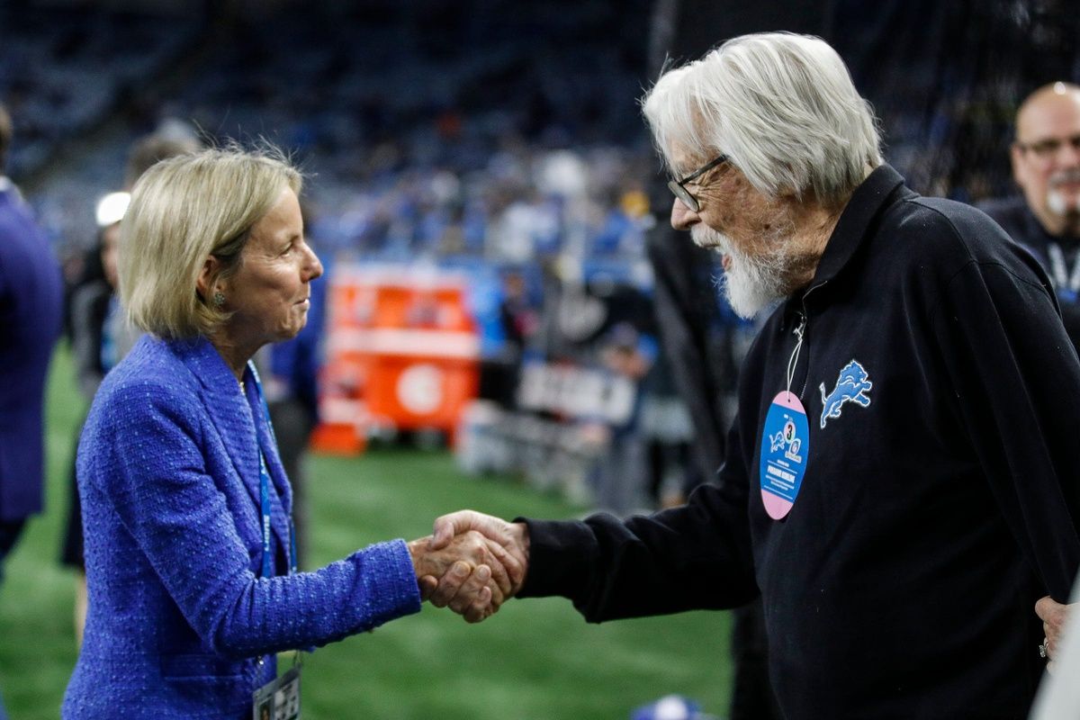 Lions principal owner and chair Sheila Hamp shakes hands with Bob Seger before the NFC divisional playoff game between the Lions and Buccaneers at Ford Field on Sunday, Jan. 21, 2024.