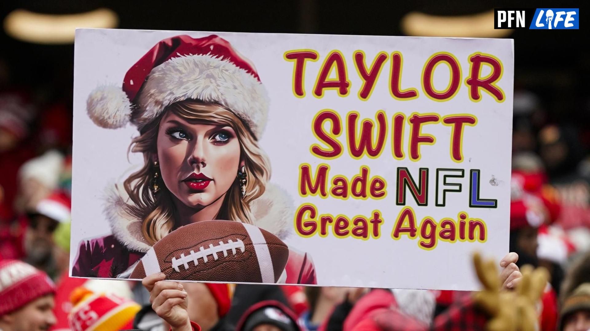 A Kansas City Chiefs fan holds a Taylor Swift sign during the first half against the Las Vegas Raiders at GEHA Field at Arrowhead Stadium.