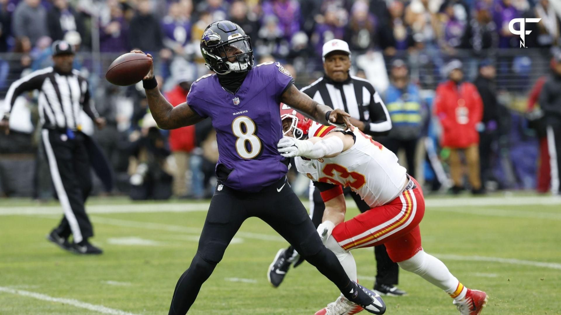 Baltimore Ravens quarterback Lamar Jackson (8) throws the ball as Kansas City Chiefs linebacker Drue Tranquill (23) defends during the first half in the AFC Championship football game at M&T Bank Stadium.