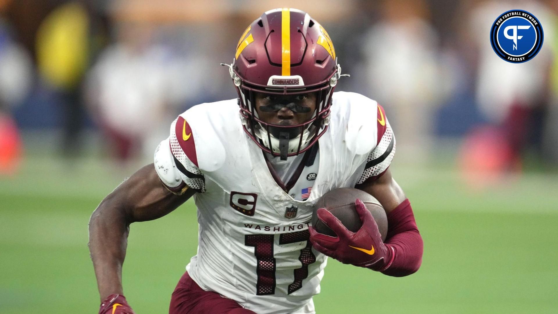 Washington Commanders wide receiver Terry McLaurin (17) carries the ball against the Los Angeles Rams in the second half at SoFi Stadium.