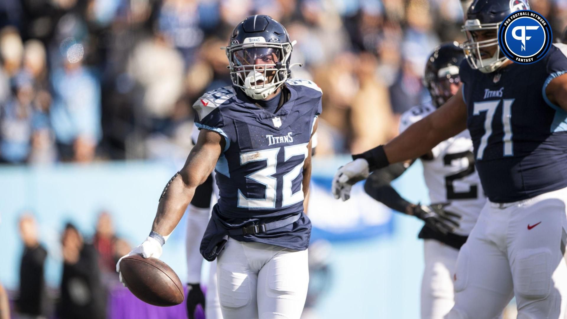 Tennessee Titans running back Tyjae Spears (32) celebrates after a touchdown against the Jacksonville Jaguars during the first half at Nissan Stadium.