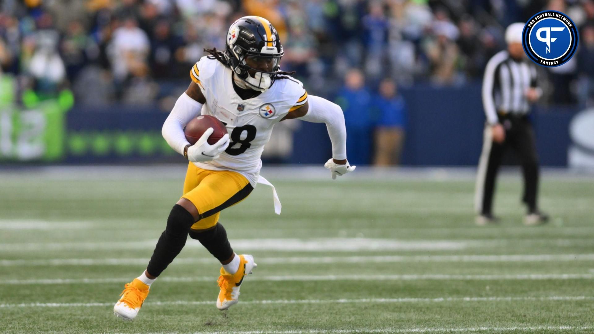 Pittsburgh Steelers wide receiver Diontae Johnson (18) carries the ball against the Seattle Seahawks during the second half at Lumen Field.