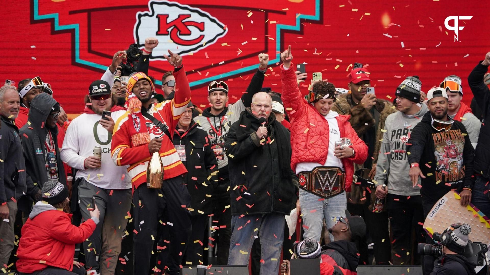 Kansas City Chiefs head coach Andy Reid celebrates with quarterback Patrick Mahomes (15) and other players during the Kansas City Chiefs Super Bowl parade.