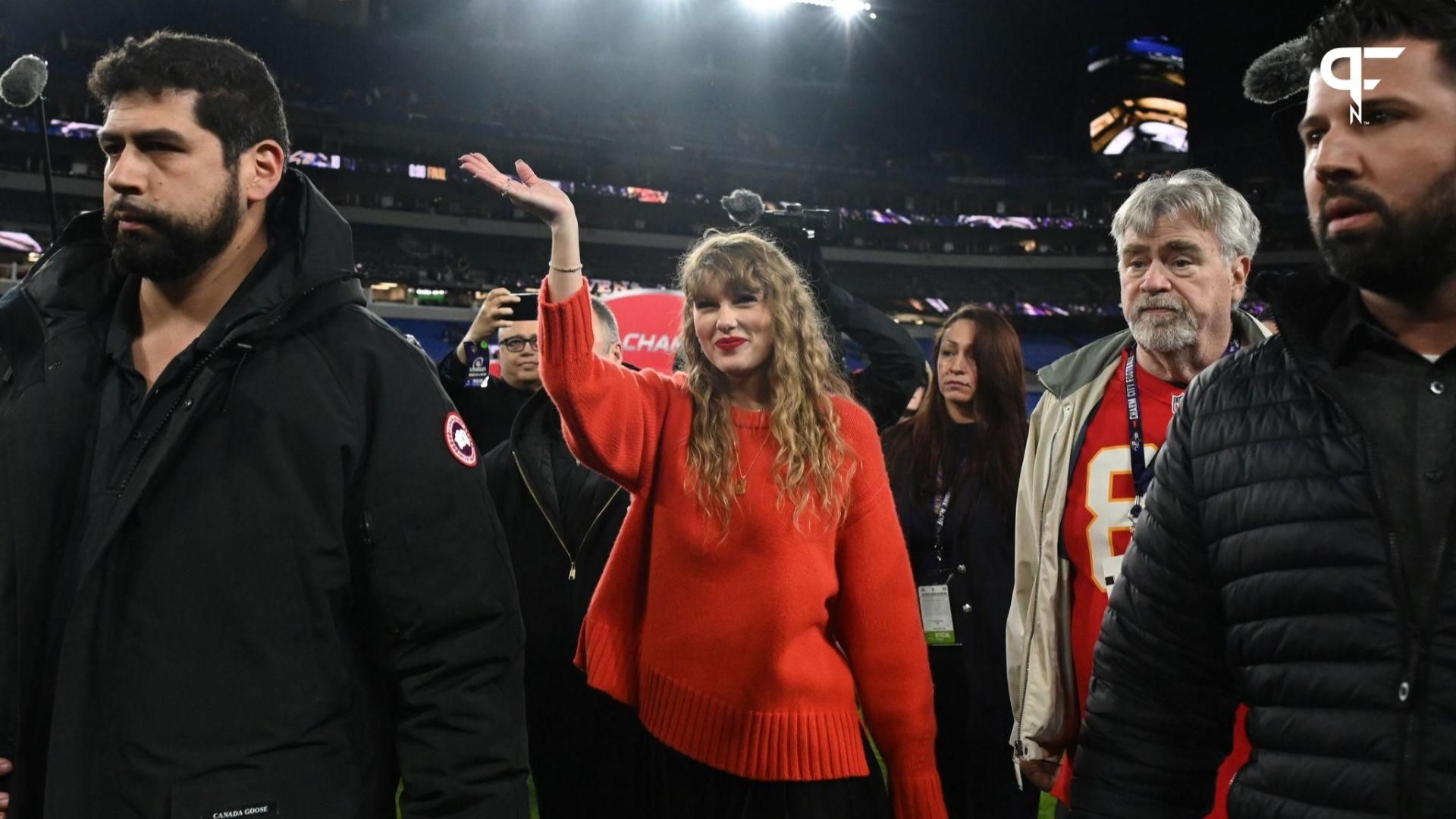 American singer-songwriter Taylor Swift (center) walks off the field after the Kansas City Chiefs won the AFC Championship football game against the Baltimore Ravens at M&T Bank Stadium.