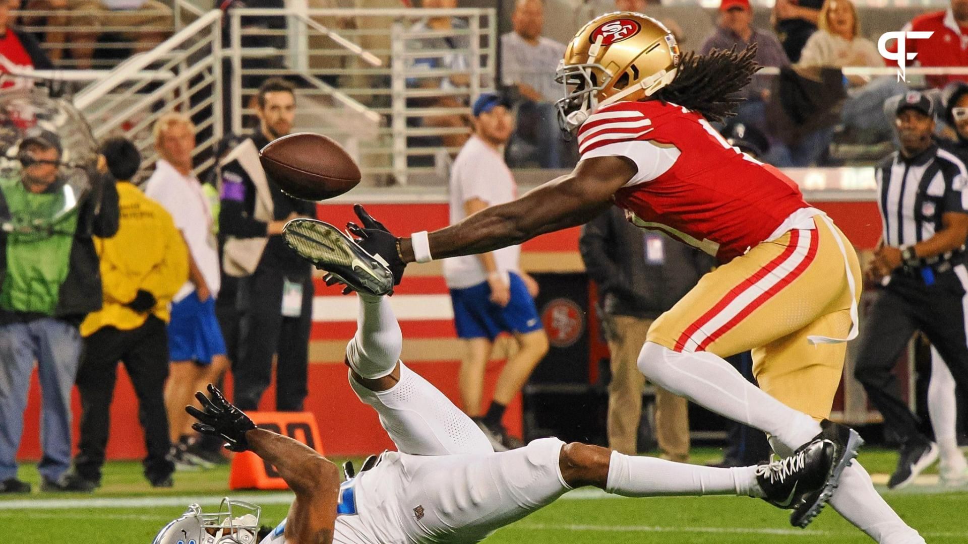 San Francisco 49ers wide receiver Brandon Aiyuk (11) catches a ball that bounced off the face mask of Detroit Lions cornerback Kindle Vildor (29) during the second half of the NFC Championship football game at Levi's Stadium.