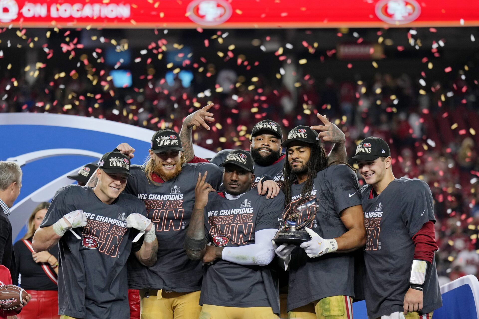 San Francisco 49ers running back Christian McCaffrey (23), tight end George Kittle (85), offensive tackle Trent Williams (71), wide receiver Deebo Samuel (19), and linebacker Fred Warner (54), and quarterback Brock Purdy (13) celebrate after winning the NFC Championship football game against the Detroit Lions at Levi's Stadium.