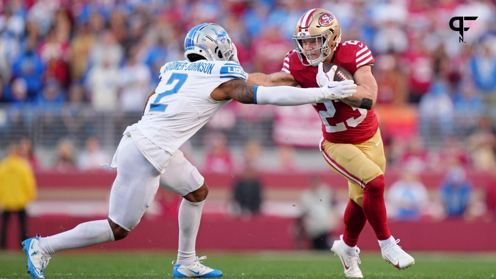 San Francisco 49ers running back Christian McCaffrey (23) stiff arms Detroit Lions safety C.J. Gardner-Johnson (2) during the first half of the NFC Championship football game at Levi's Stadium.