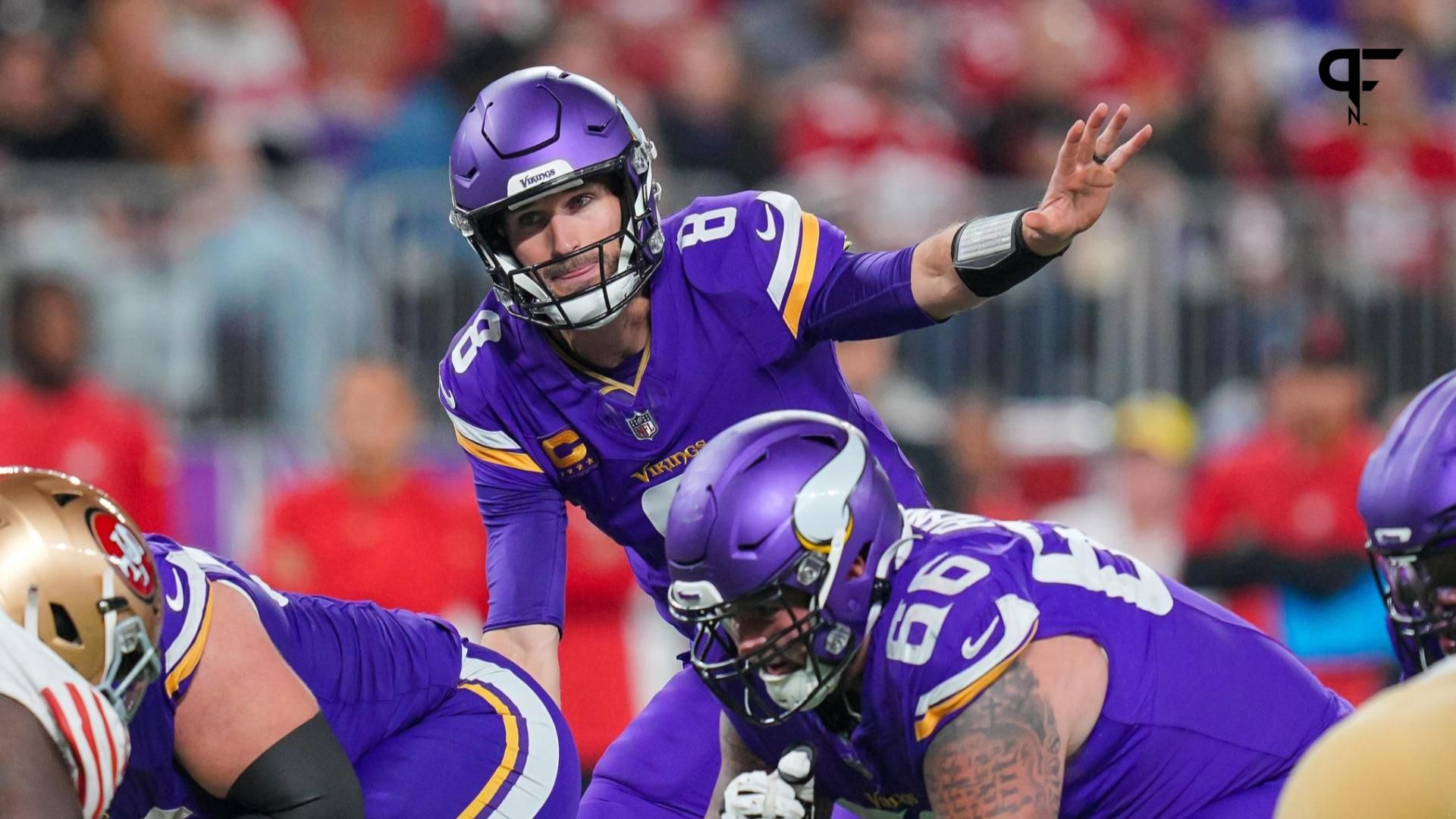 Minnesota Vikings quarterback Kirk Cousins (8) signals his team against the San Francisco 49ers in the third quarter at U.S. Bank Stadium.