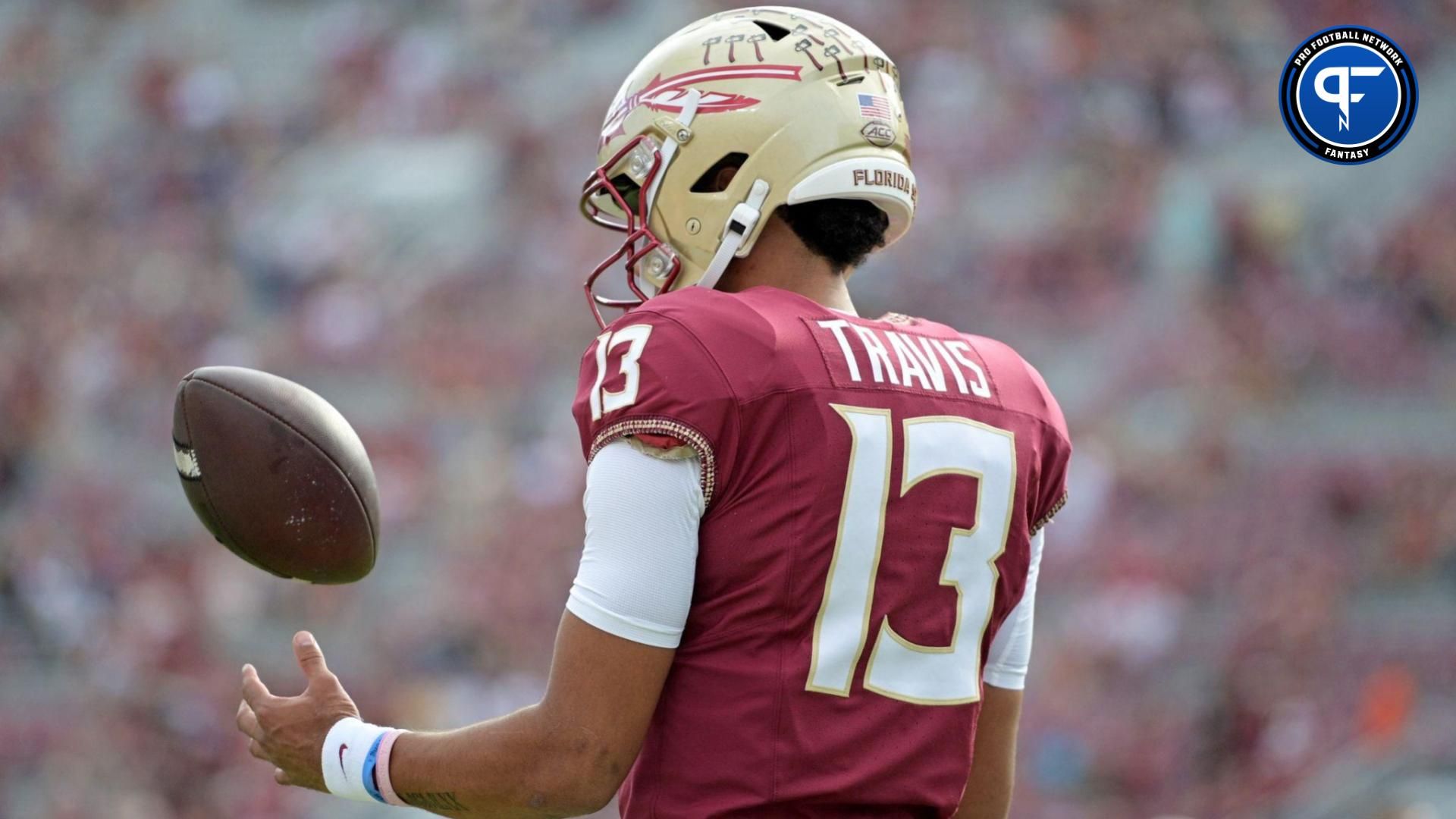 Nov 11, 2023; Tallahassee, Florida, USA; Florida State Seminoles quarterback Jordan Travis (13) takes a moment to himself before the game against the Miami Hurricanes at Doak S. Campbell Stadium.