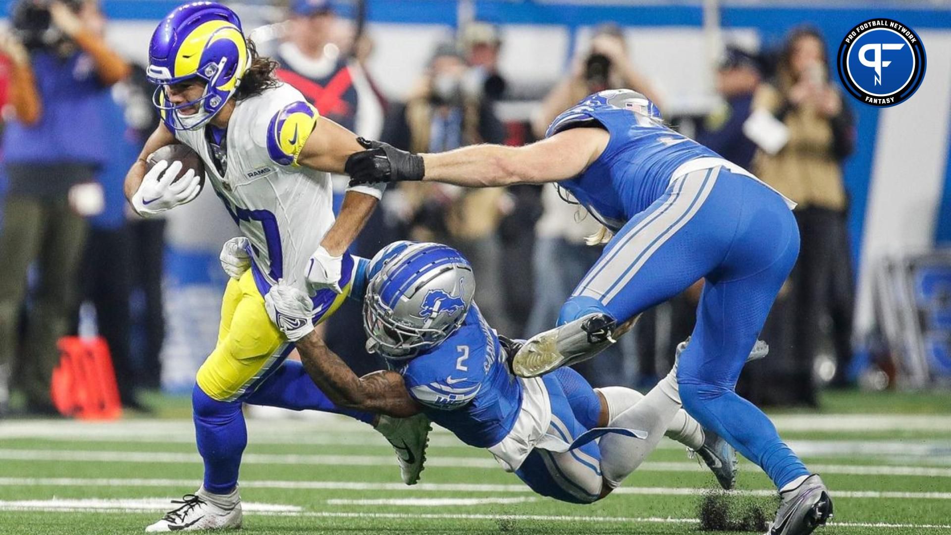 Los Angeles Rams wide receiver Puka Nacua runs against Detroit Lions safety C.J. Gardner-Johnson and linebacker Alex Anzalone during the first half of the NFC wild-card game at Ford Field in Detroit on Sunday, Jan. 14, 2024.