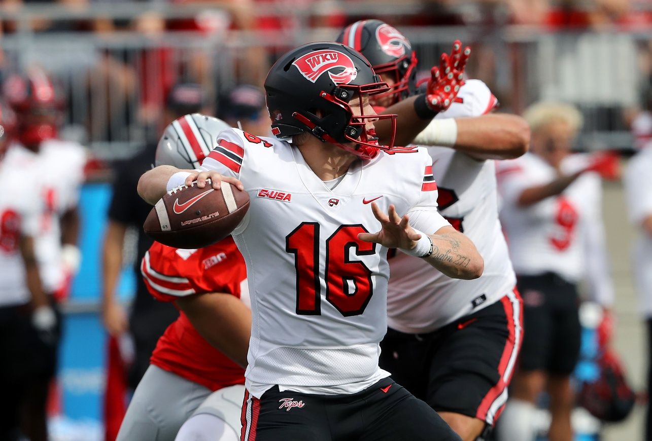 Sep 16, 2023; Columbus, Ohio, USA; Western Kentucky Hilltoppers quarterback Austin Reed (16) drops to throw during the first quarter against the Ohio State Buckeyes at Ohio Stadium.