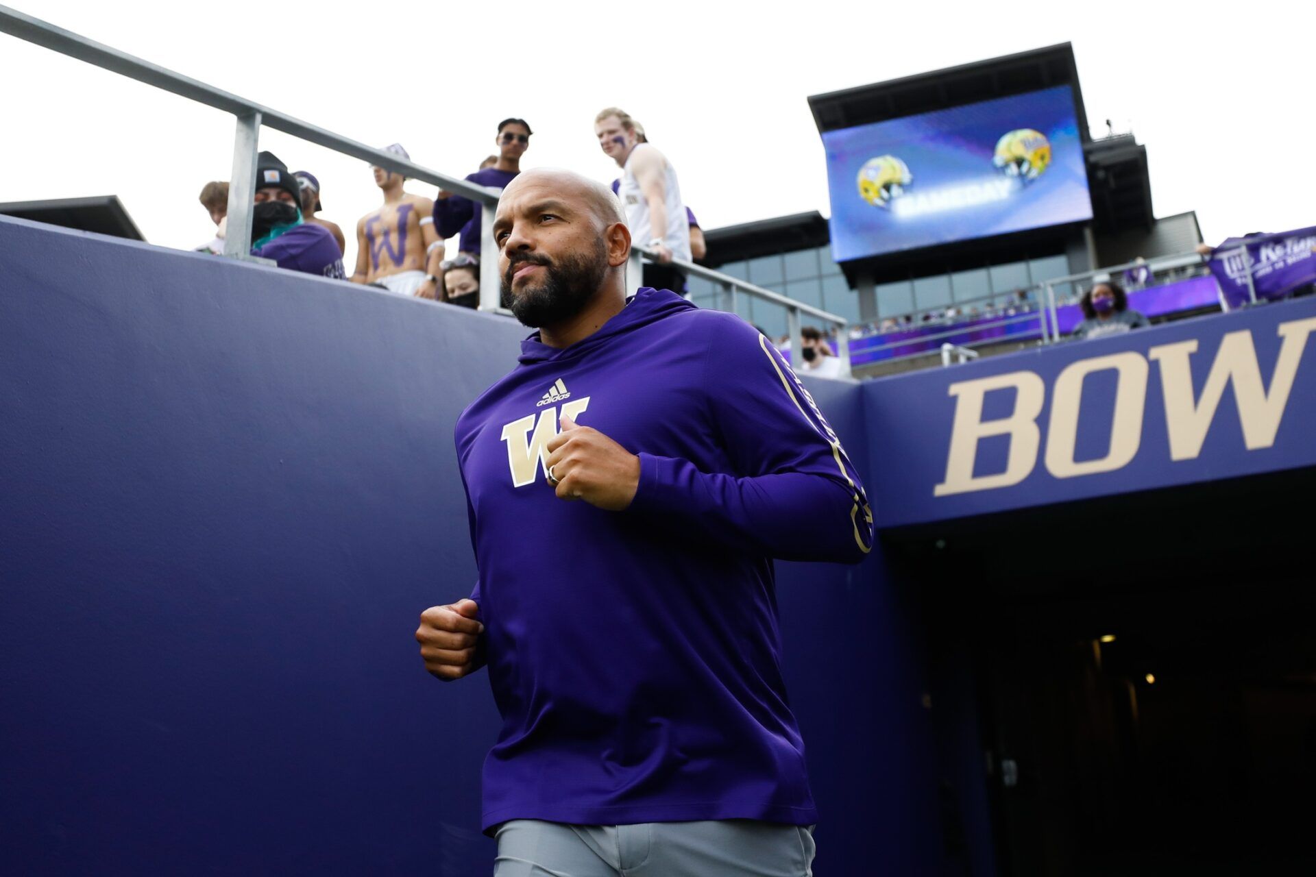 Washington Huskies head coach Jimmy Lake exits the locker room before a game against the UCLA Bruins at Alaska Airlines Field at Husky Stadium.