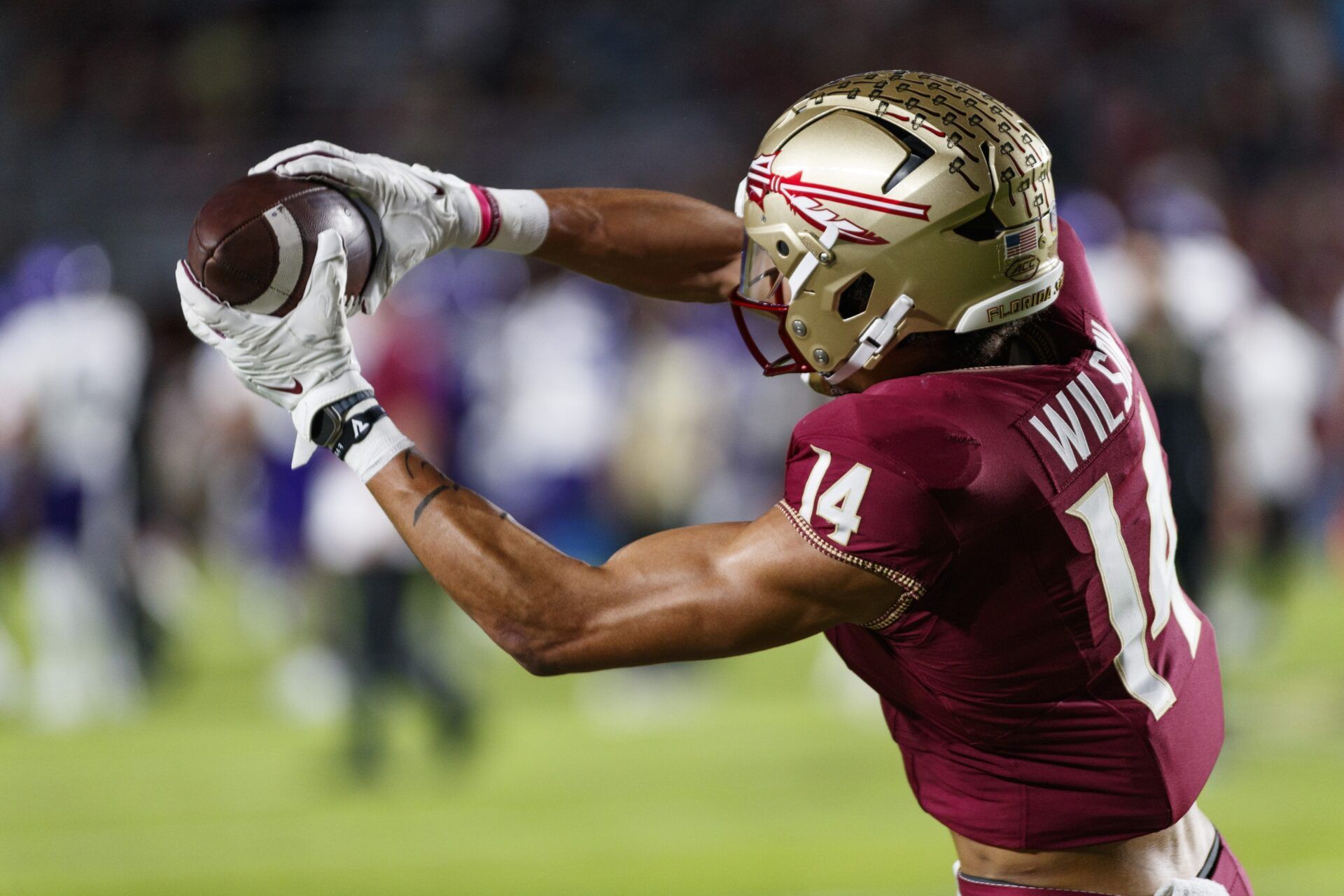 Florida State Seminoles WR Johnny Wilson (14) catches the ball during warmups.