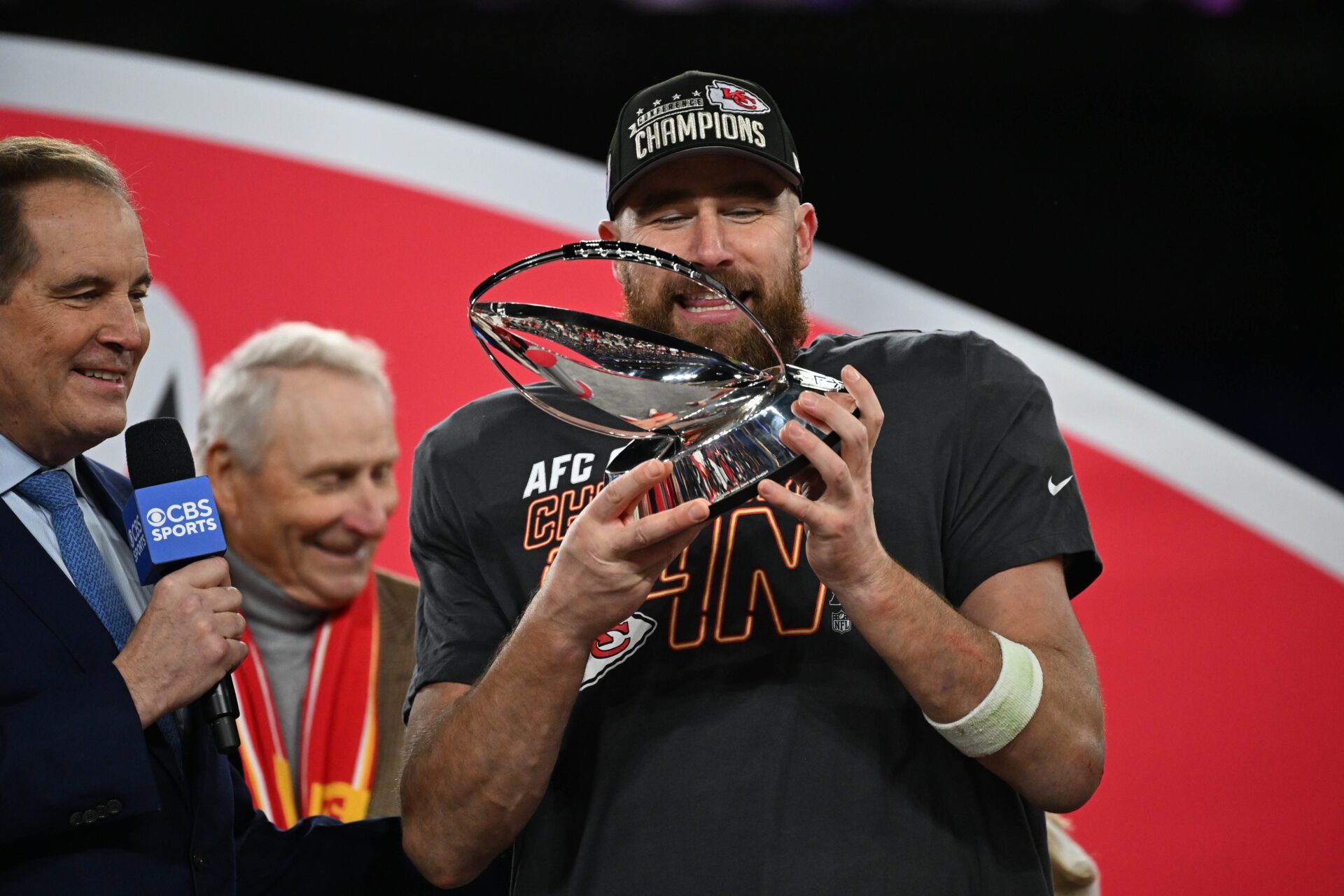 Kansas City Chiefs TE Travis Kelce holds the Lamar Hunt Trophy after the team's win in the AFC Championship Game over the Baltimore Ravens.