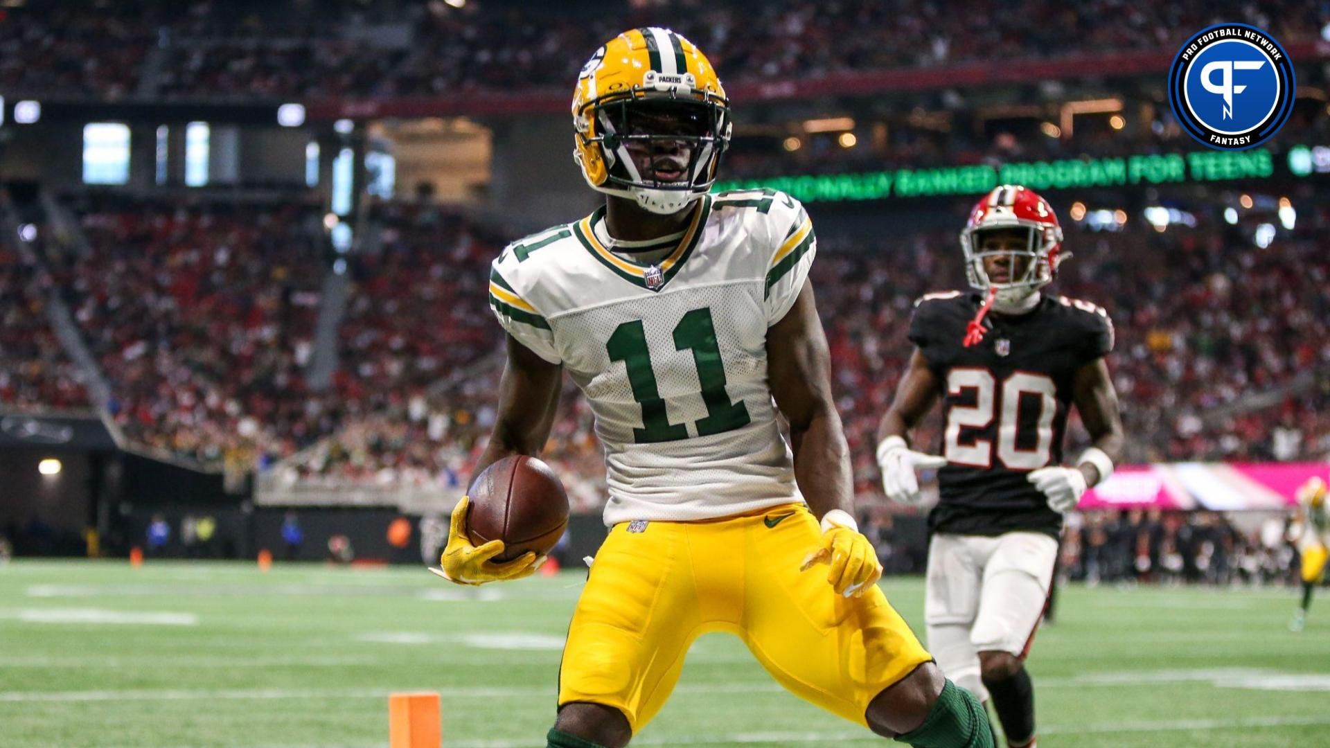 Green Bay Packers wide receiver Jayden Reed (11) scores a touchdown against the Atlanta Falcons in the second half at Mercedes-Benz Stadium.