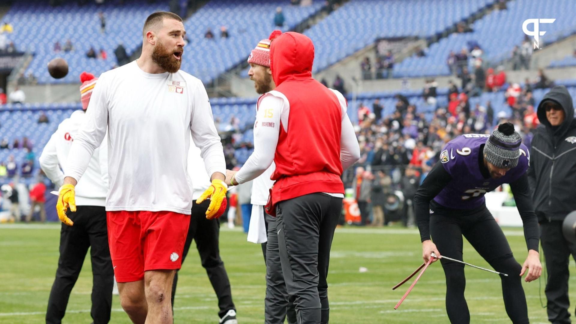 Kansas City Chiefs tight end Travis Kelce (87) exchanges words with Baltimore Ravens place kicker Justin Tucker (9) for warming up in the Chiefs' facility prior to the AFC Championship football game at M&T Bank Stadium.