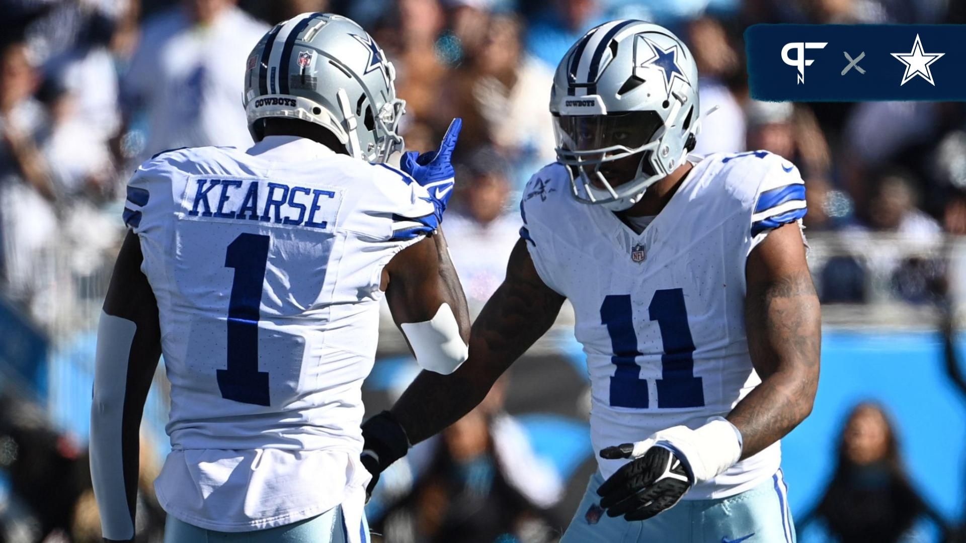 Dallas Cowboys linebacker Micah Parsons (11) celebrates with safety Jayron Kearse (1) after making a sack in the first quarter at Bank of America Stadium.