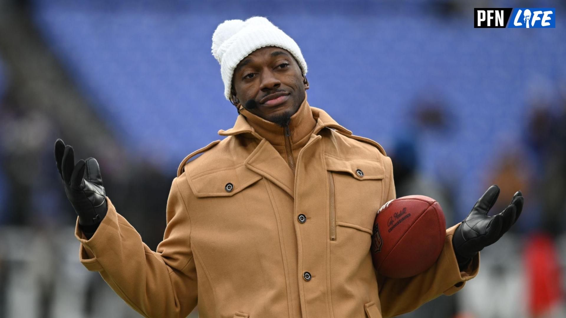 ESPN college football and NFL analyst Robert Griffin III reacts on the sidelines before a 2024 AFC divisional round game between the Houston Texans and the Baltimore Ravens at M&T Bank Stadium.