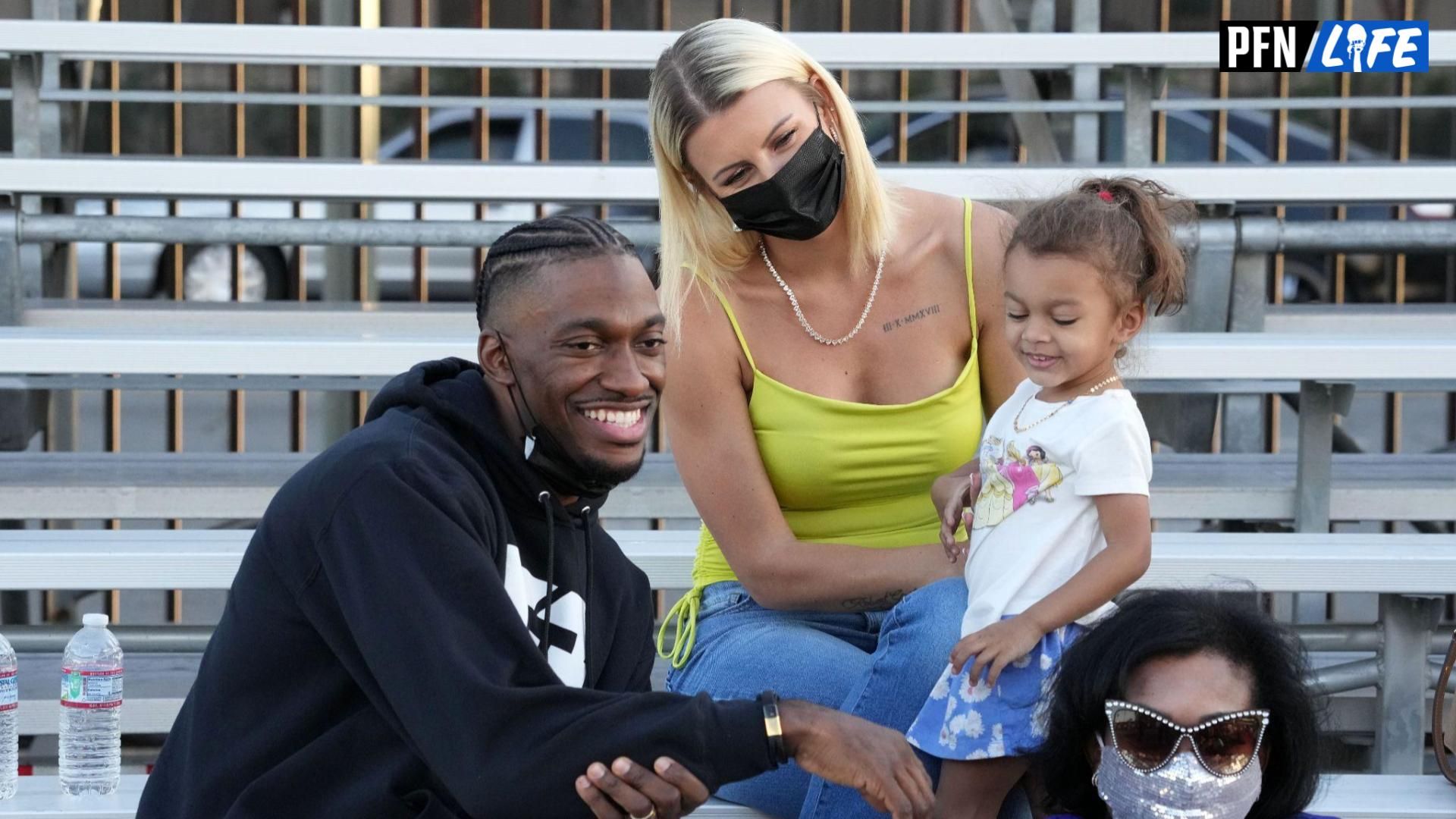 Robert Grifffin III poses with wife Grete Griffin aka Grete Sadeiko and daughter during the Salute to Service Wheelchair Football League Championship Game at the Los Angeles Memorial Coliseum.