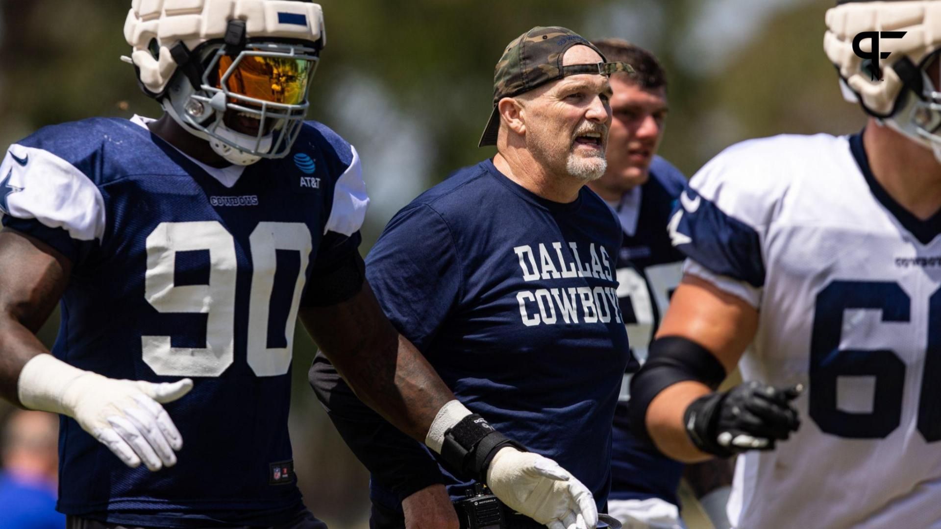 Dallas Cowboys defensive coordinator Dan Quinn talks to players during training camp at River Ridge Playing Fields in Oxnard, California.