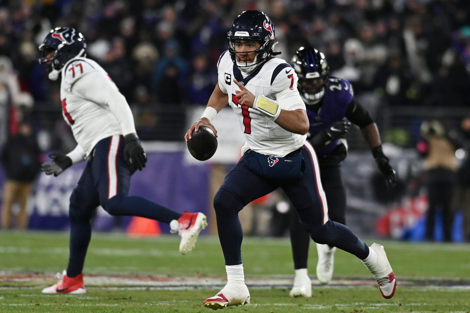 Houston Texans quarterback C.J. Stroud (7) runs the ball against the Baltimore Ravens during the second quarter of a 2024 AFC divisional round game at M&T Bank Stadium.