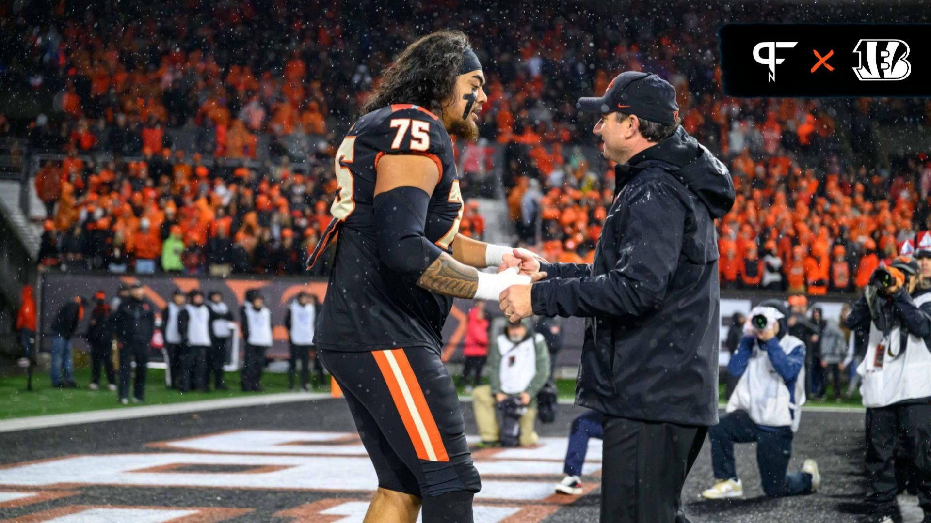 Oregon State Beavers head coach Jonathan Smith greets offensive lineman Taliese Fuaga (75) during senior ceremonies pregame against the Washington Huskies at Reser Stadium.