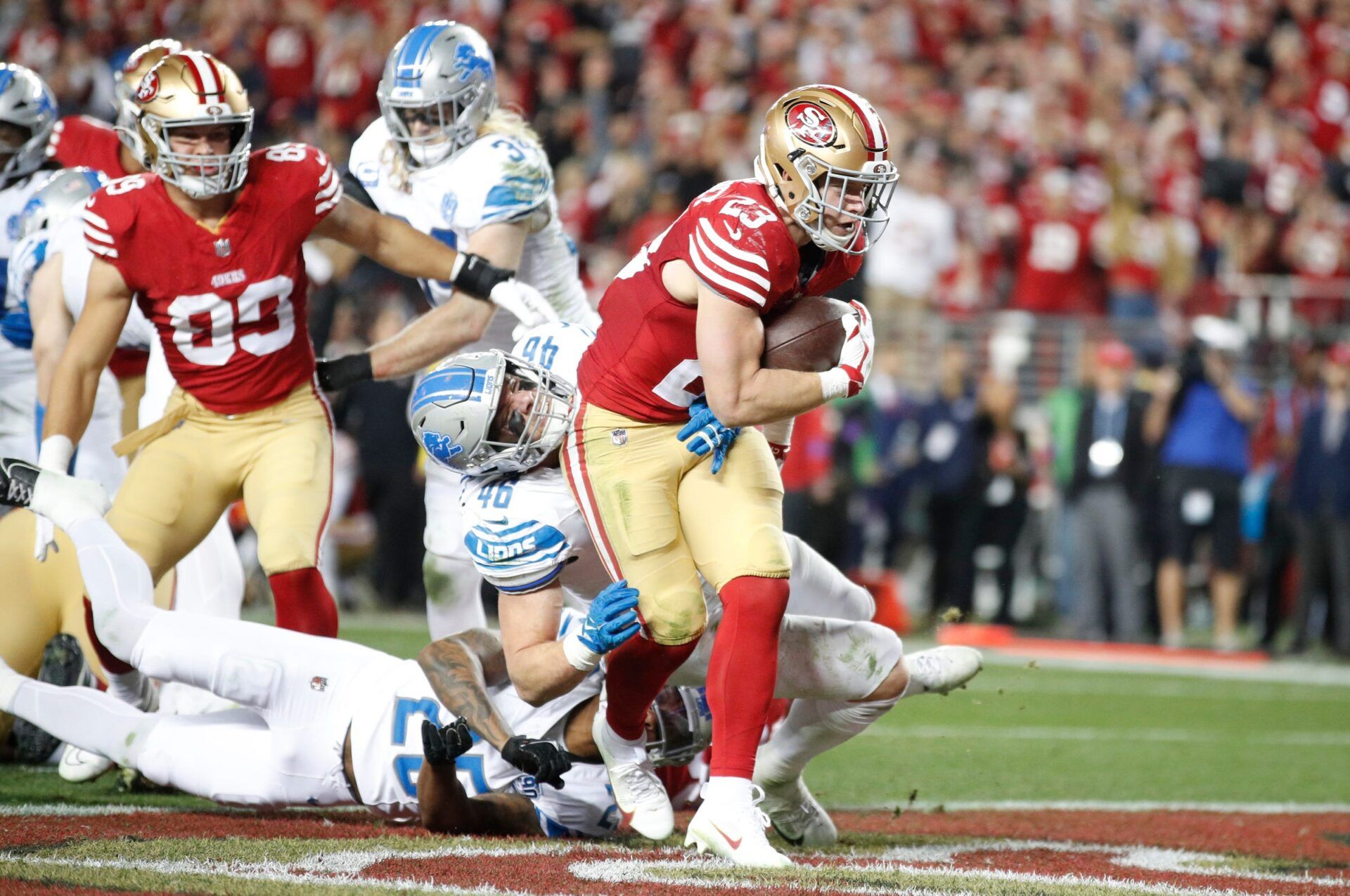 49ers running back Christian McCaffrey runs the ball in for a touchdown in the third quarter of the Lions' 34-31 loss in the NFC championship game