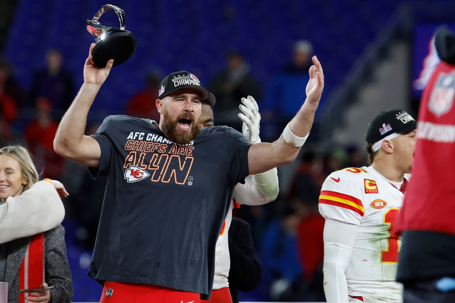 Kansas City Chiefs tight end Travis Kelce celebrates with the Lamar Hunt trophy after the Chiefs' game against the Baltimore Ravens in the AFC Championship football game at M&T Bank Stadium.