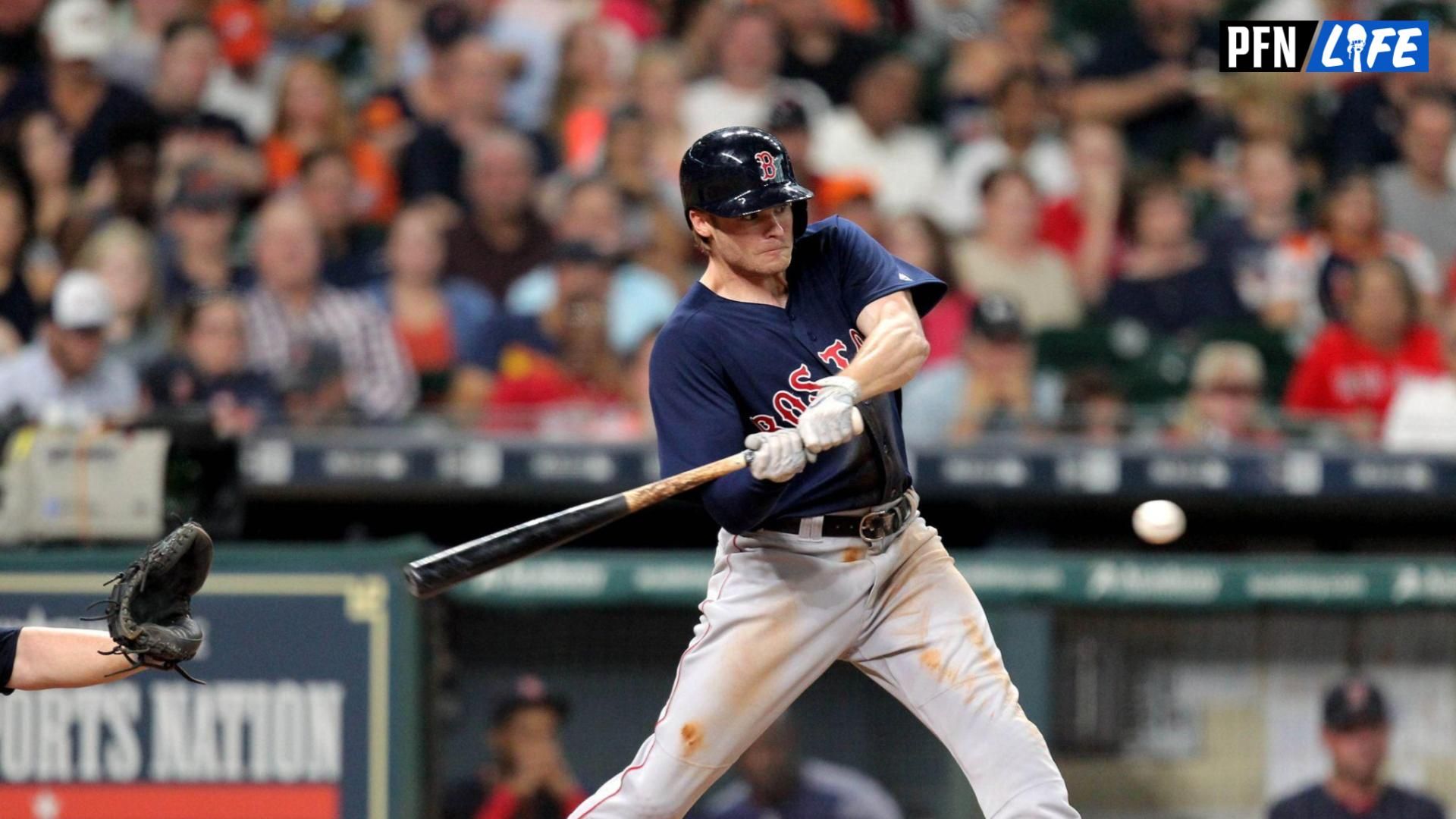 Boston Red Sox third baseman Josh Rutledge (32) swings for a base hit against the Houston Astros during the fourth inning at Minute Maid Park.