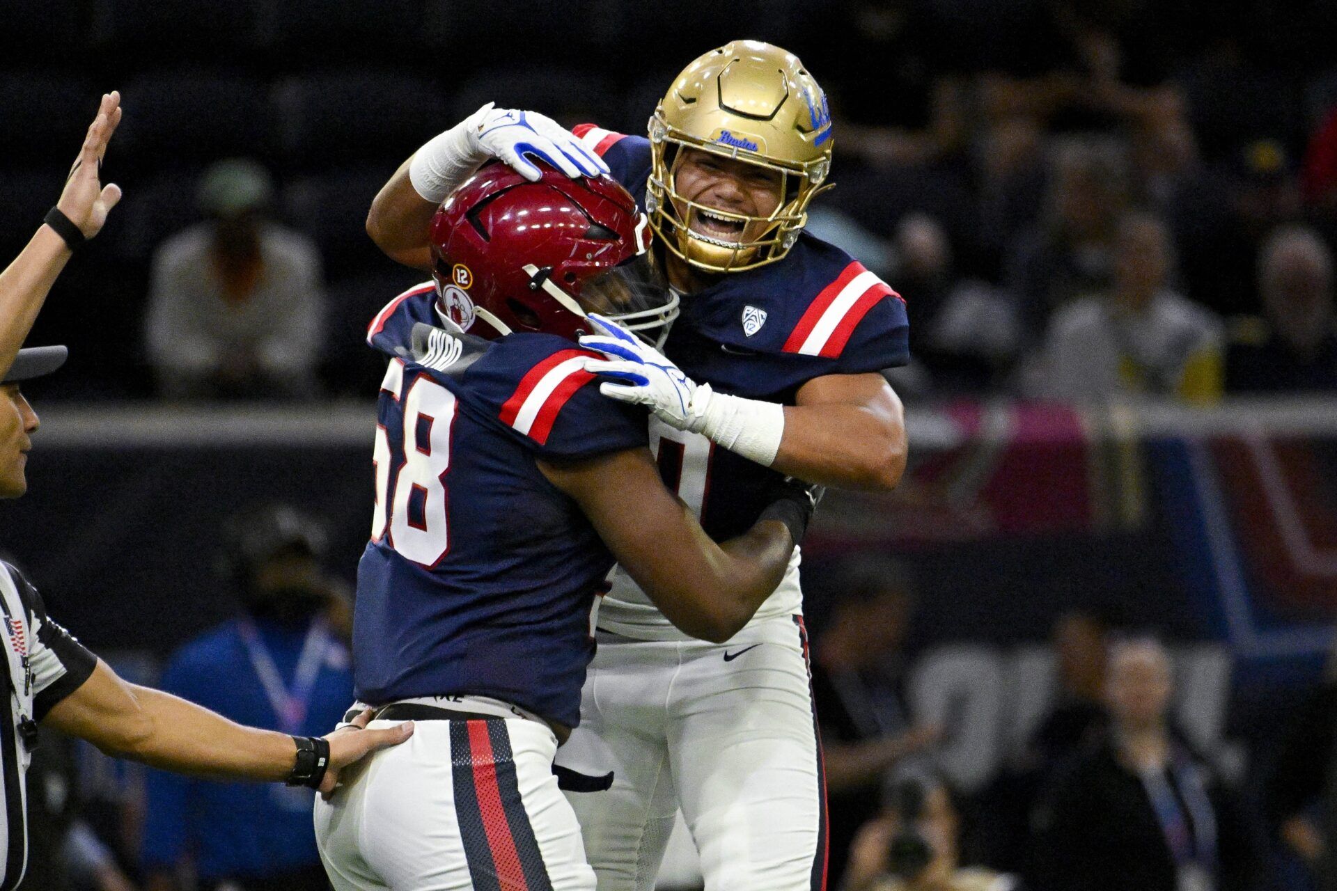 West defensive lineman Solomon Byrd of USC (58) and West linebacker Darius Muasau of UCLA (50) celebrates during the first half at the Ford Center at The Star.