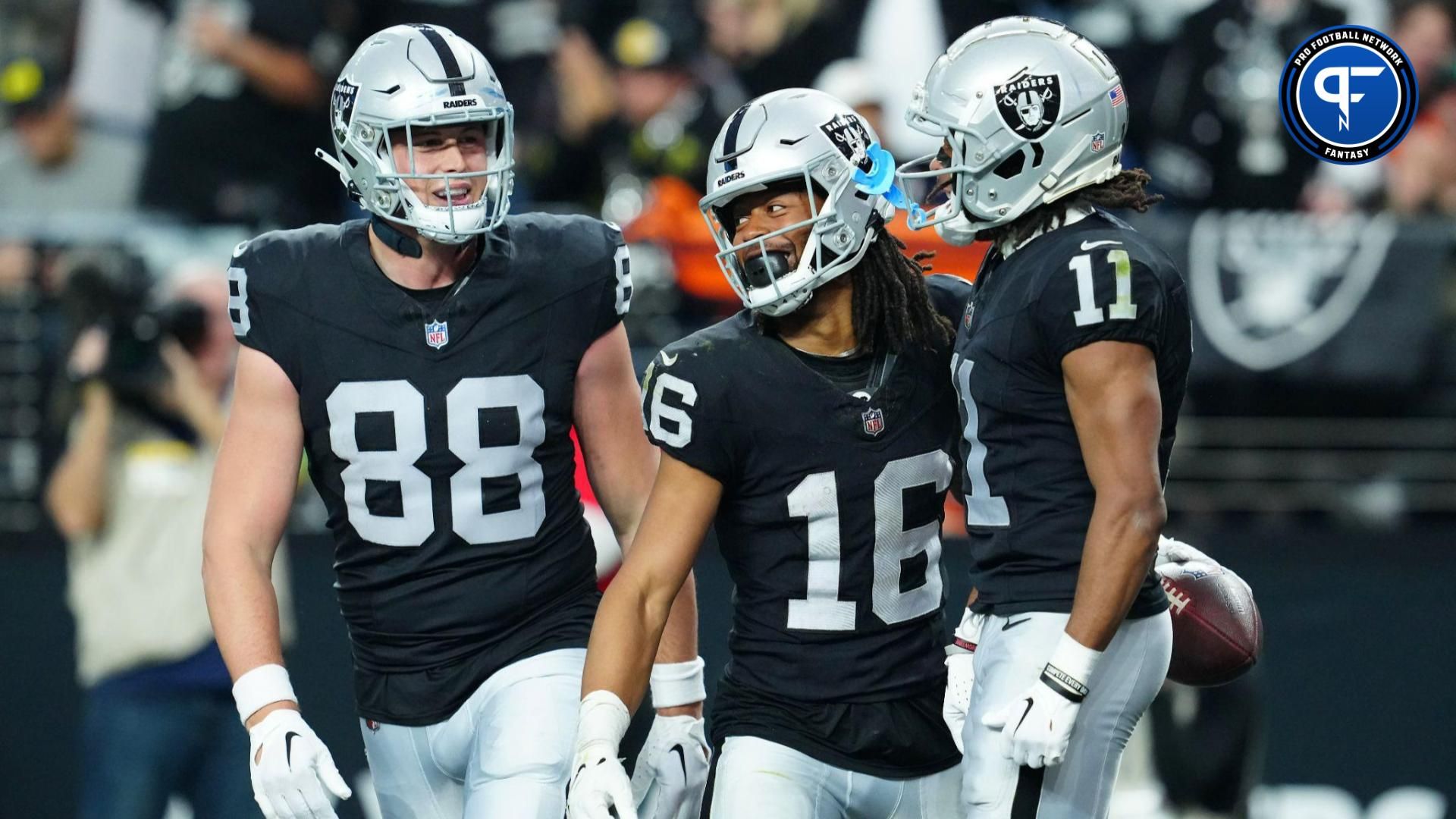 Las Vegas Raiders wide receiver Jakobi Meyers (16) celebrates with Las Vegas Raiders tight end Zach Gentry (88) and Las Vegas Raiders wide receiver Tre Tucker (11) at Allegiant Stadium.