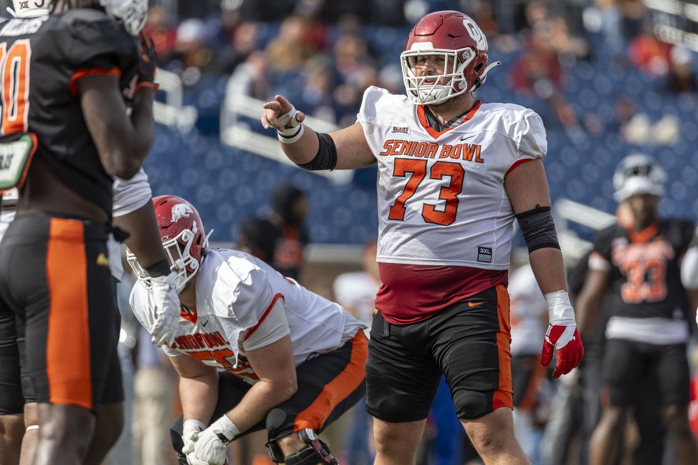 American offensive lineman Andrew Raym of Oklahoma (73) signals before a play during practice for the American team at Hancock Whitney Stadium.