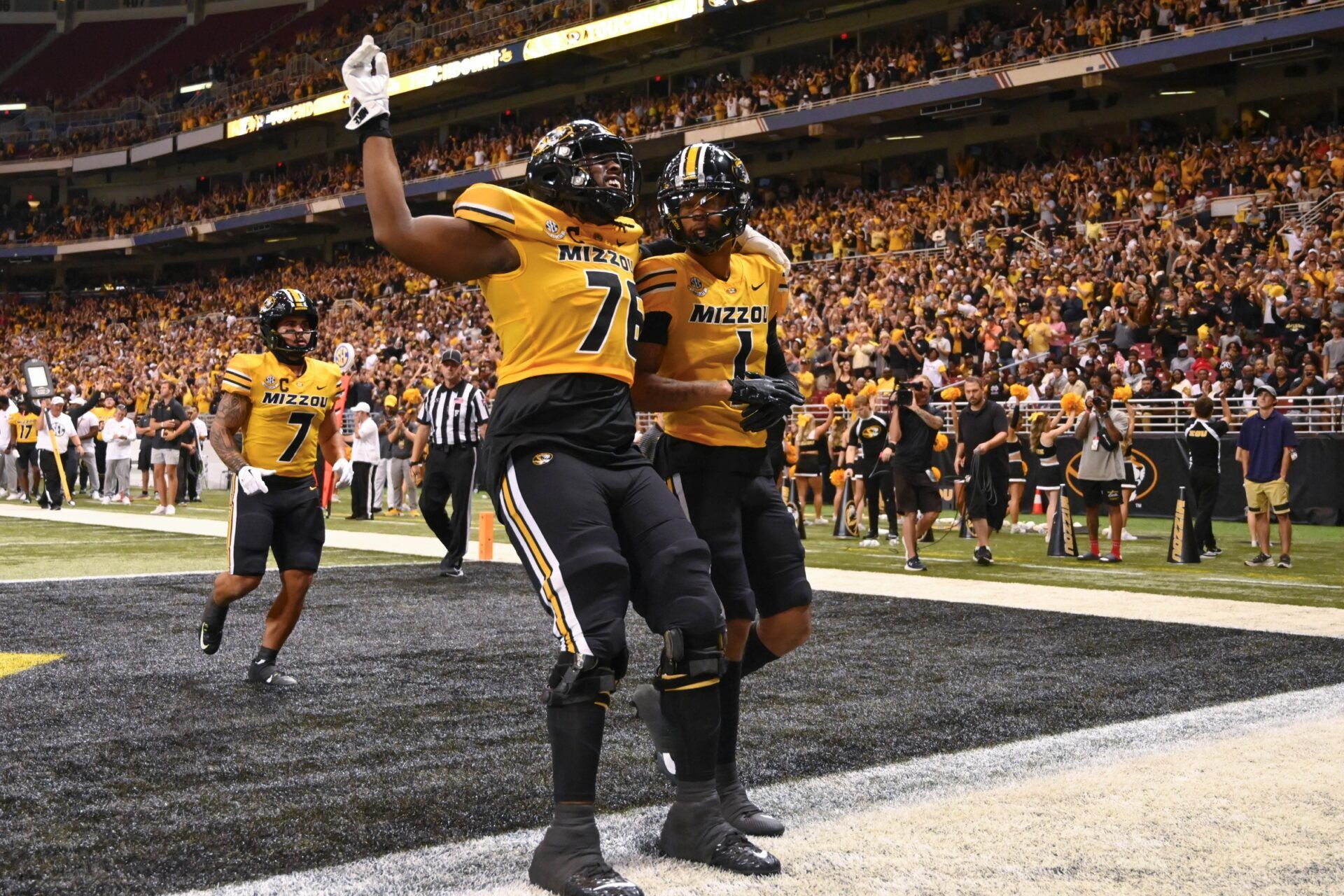 Missouri Tigers wide receiver Theo Wease Jr. (1) is congratulated by Missouri Tigers offensive lineman Javon Foster (76) after Wease Jr. scores a touchdown against the Memphis Tigers during the third quarter at The Dome at America's Center.