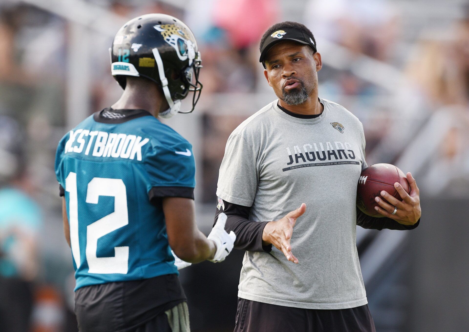 Dede Westbrook gets instructions from wide receivers coach Keenan McCardell during Tuesday morning's minicamp session. The Jacksonville Jaguars held their first day of 2019 mandatory minicamp at the practice fields by TIAA Bank Field.