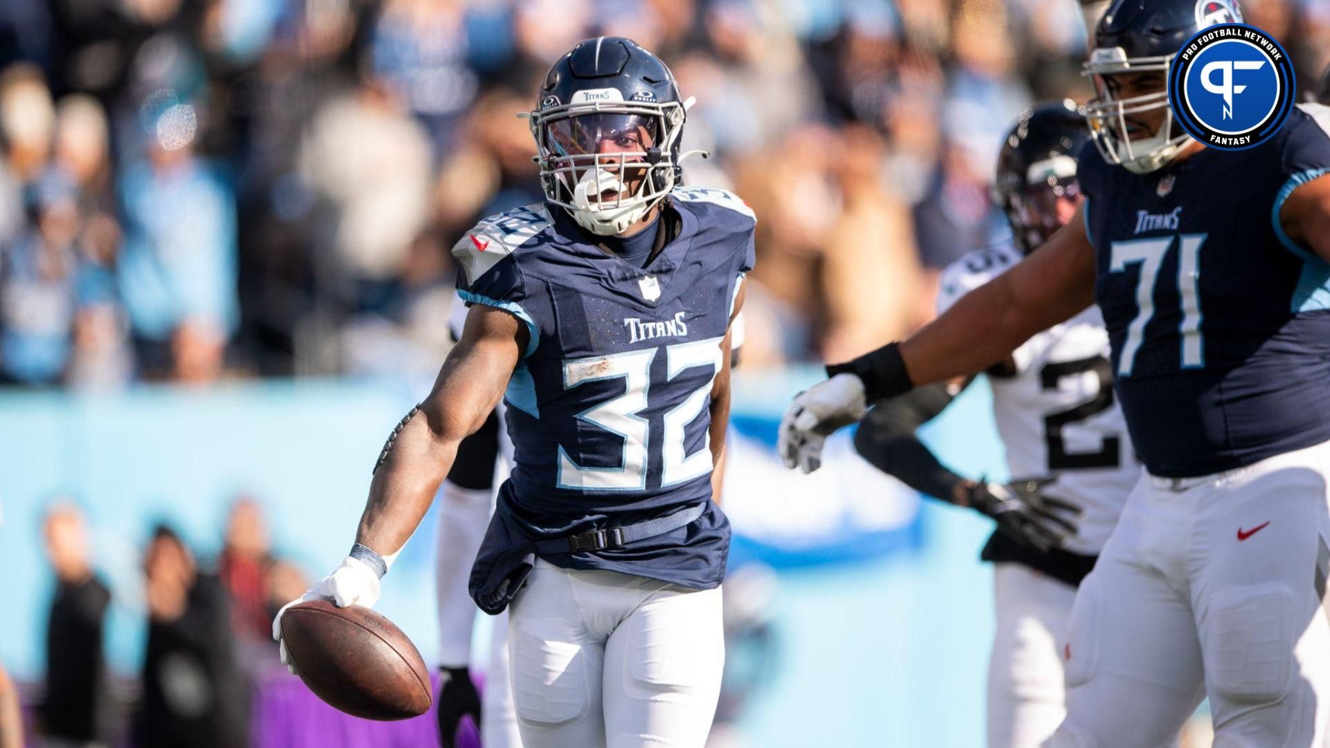 Tennessee Titans running back Tyjae Spears (32) celebrates after a touchdown against the Jacksonville Jaguars during the first half at Nissan Stadium.