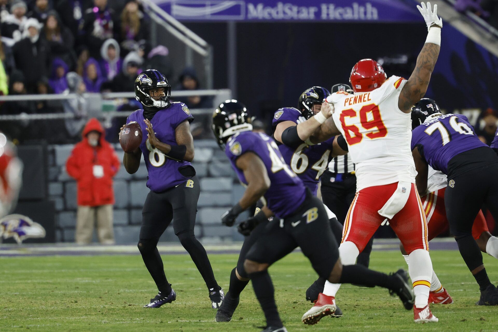 Baltimore Ravens quarterback Lamar Jackson (8) prepares to throw the ball against the Kansas City Chiefs during the second half in the AFC Championship football game at M&T Bank Stadium.