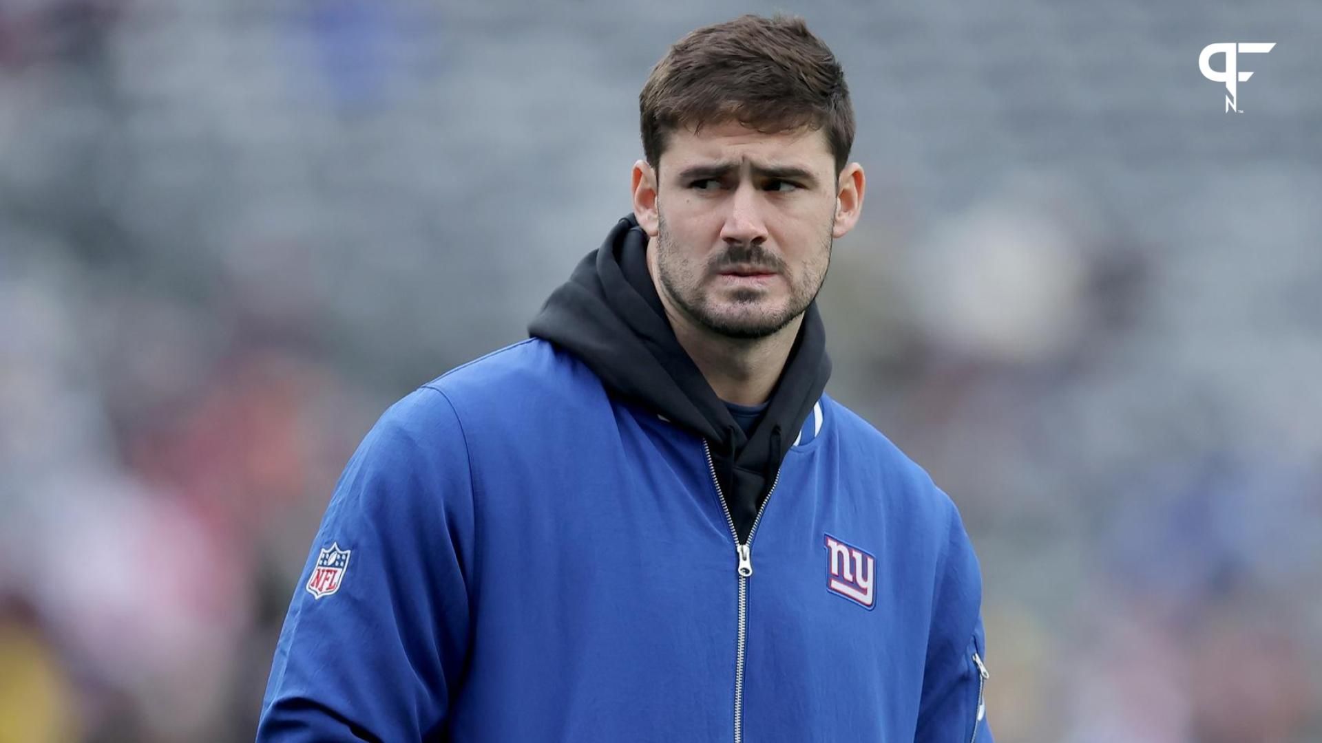 New York Giants injured quarterback Daniel Jones (8) watches warmups before a game against the Los Angeles Rams at MetLife Stadium.