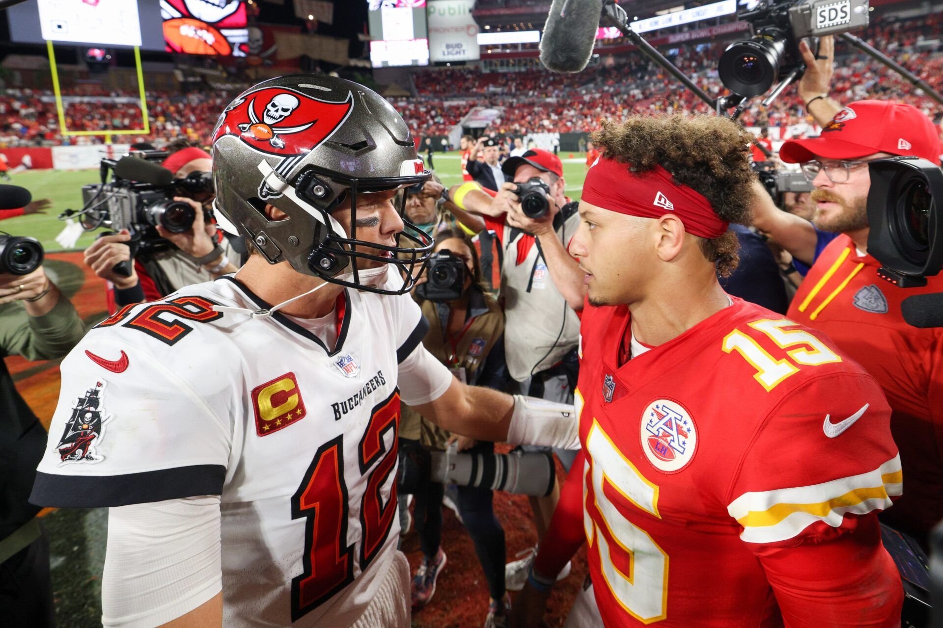 Tampa Bay Buccaneers quarterback Tom Brady (12) greets Kansas City Chiefs quarterback Patrick Mahomes (15) after a game at Raymond James Stadium.