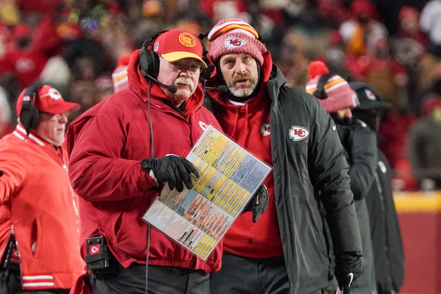 Kansas City Chiefs head coach Andy Reid talks with offensive coordinator Matt Nagy (right) against the Miami Dolphins in a 2024 AFC wild card game at GEHA Field at Arrowhead Stadium.