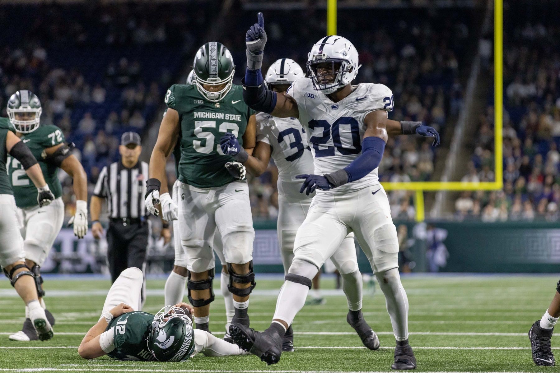 Penn State Nittany Lions defensive end Adisa Isaac (20) celebrates a sack of Michigan State Spartans quarterback Katin Houser (12) during the second half at Ford Field.