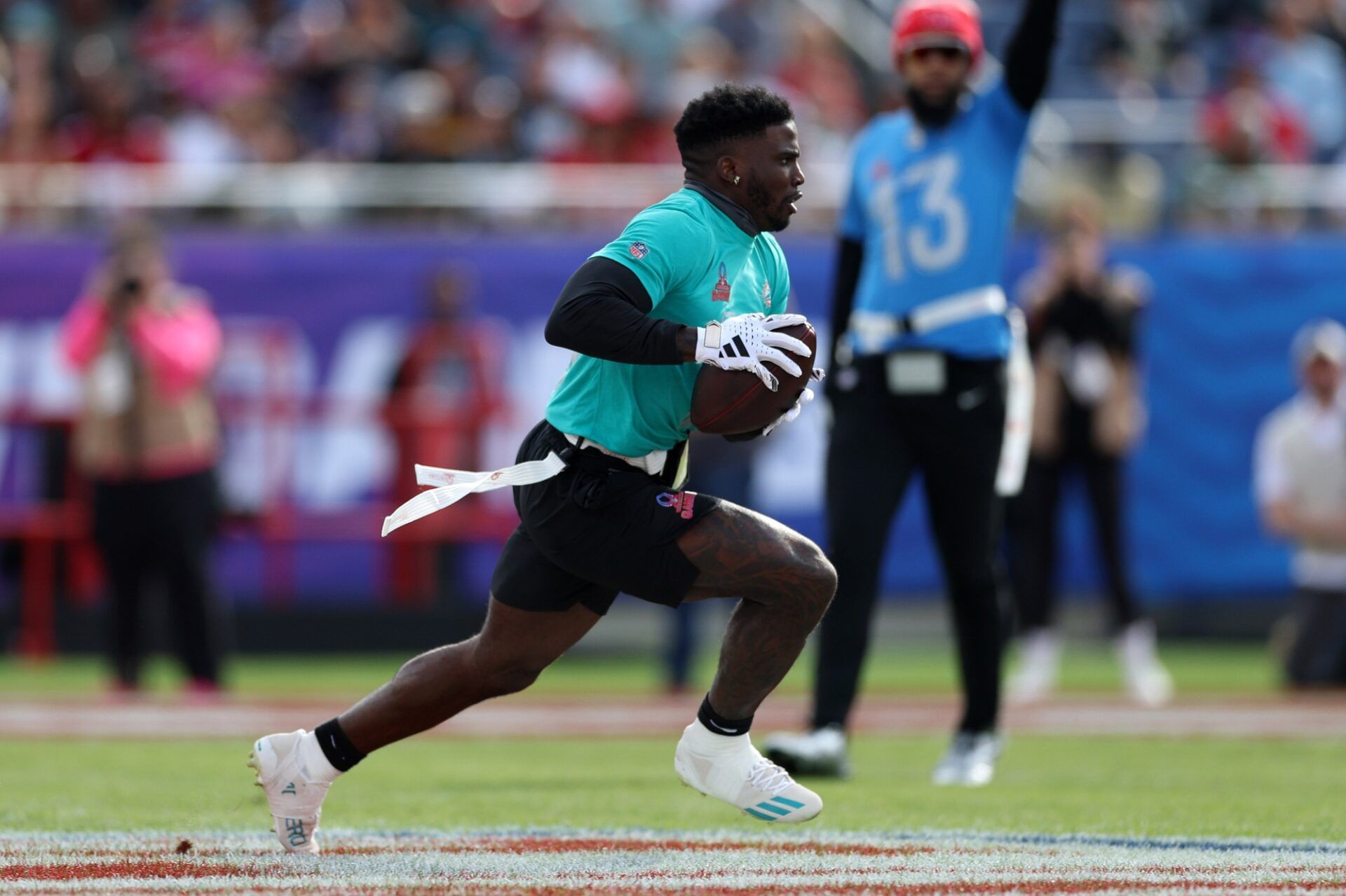 Miami Dolphins WR Tyreek Hill runs after the catch during the 2024 Pro Bowl.