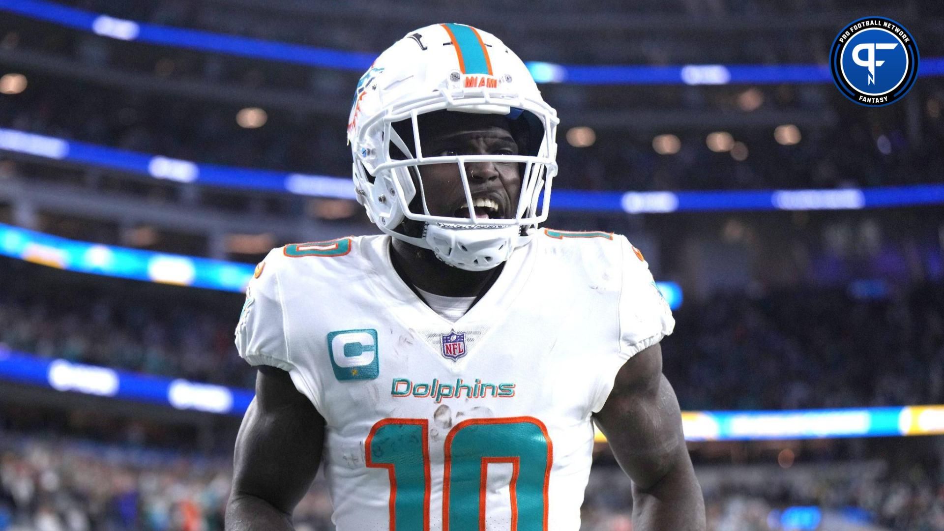 Miami Dolphins wide receiver Tyreek Hill (10) celebrates after scoring on a 60-yard touchdown reception in the second half against the Los Angeles Chargers at SoFi Stadium.