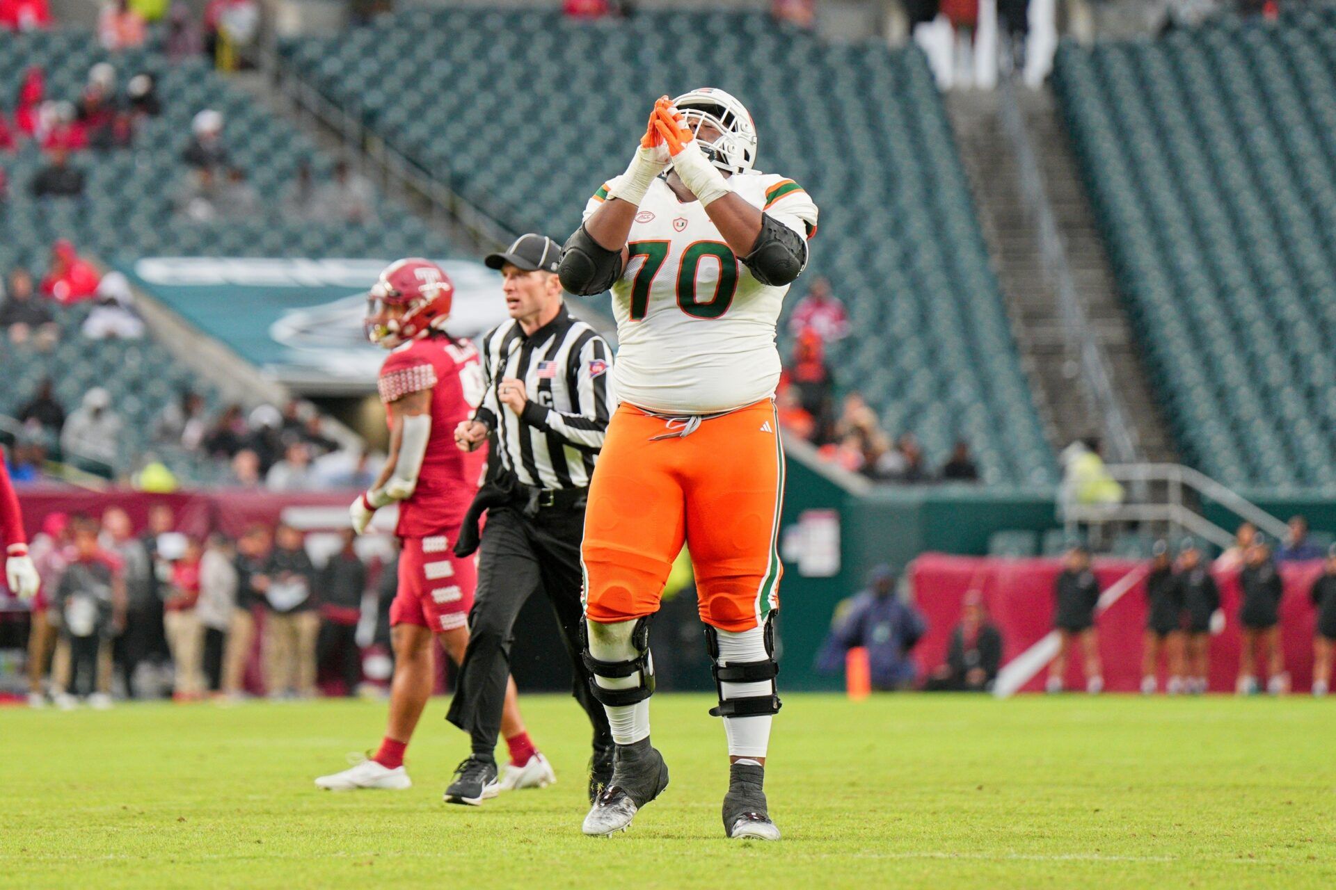 Miami Hurricanes offensive lineman Javion Cohen (70) celebrates a touchdown in the third quarter against the Temple Owls at Lincoln Financial Field.