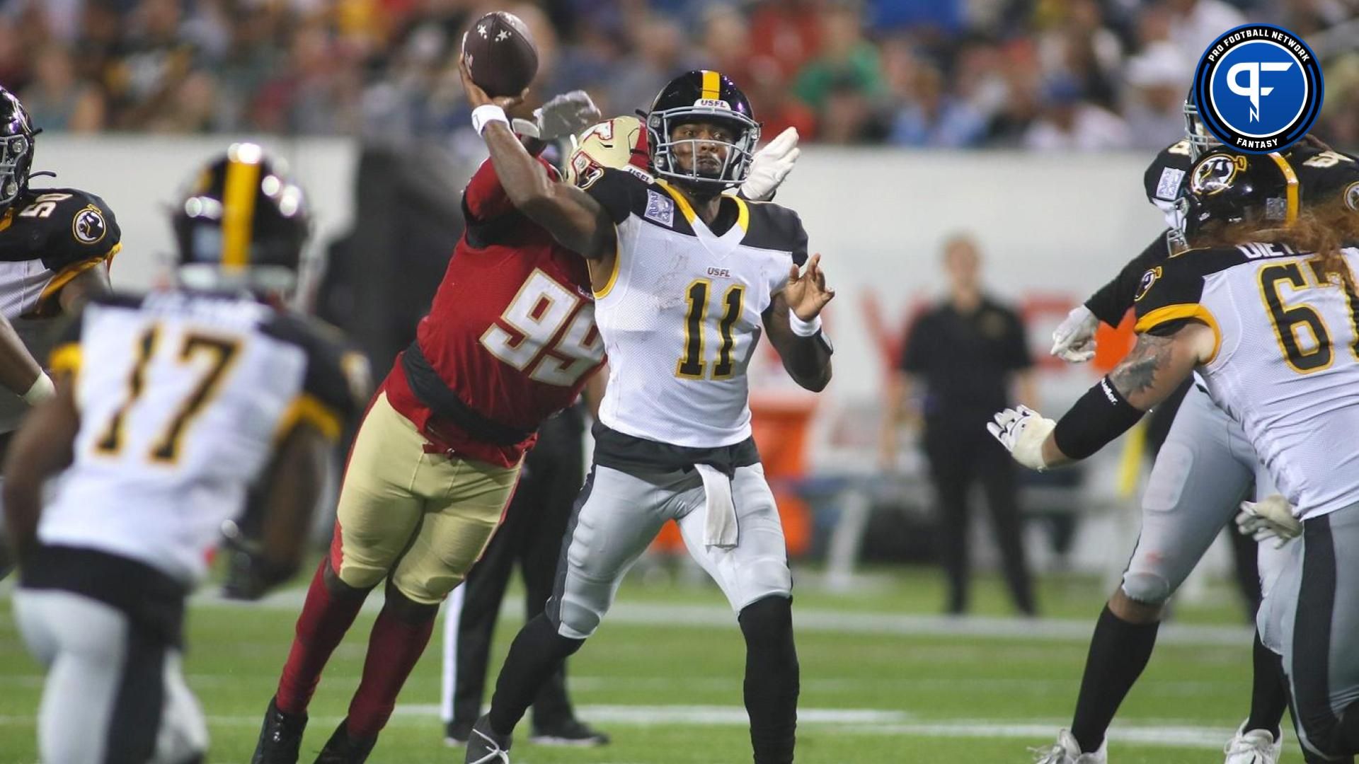 Pittsburgh Maulers Troy Williams (11) throws downfield before being tackled by Birmingham Stallions Dondrea Tillman (99) during the second half of the USFL Championship game Saturday evening at Tom Benson Stadium in Canton, OH.